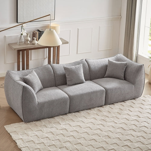 Canapé 3 places gris en tissu teddy à assise profonde